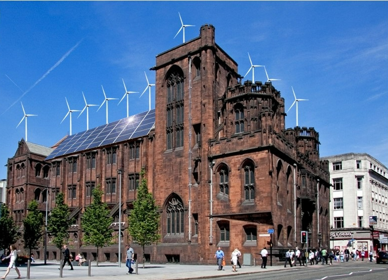 Exterior of the neo-gothic red sandstone John Rylands Research Institute and Library, showing wind turbines and solar panels.